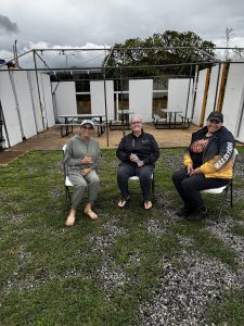 Charla, Nikki & Kahea waiting in the parking lot to let church members know the service will only be streaming online due to the storm.